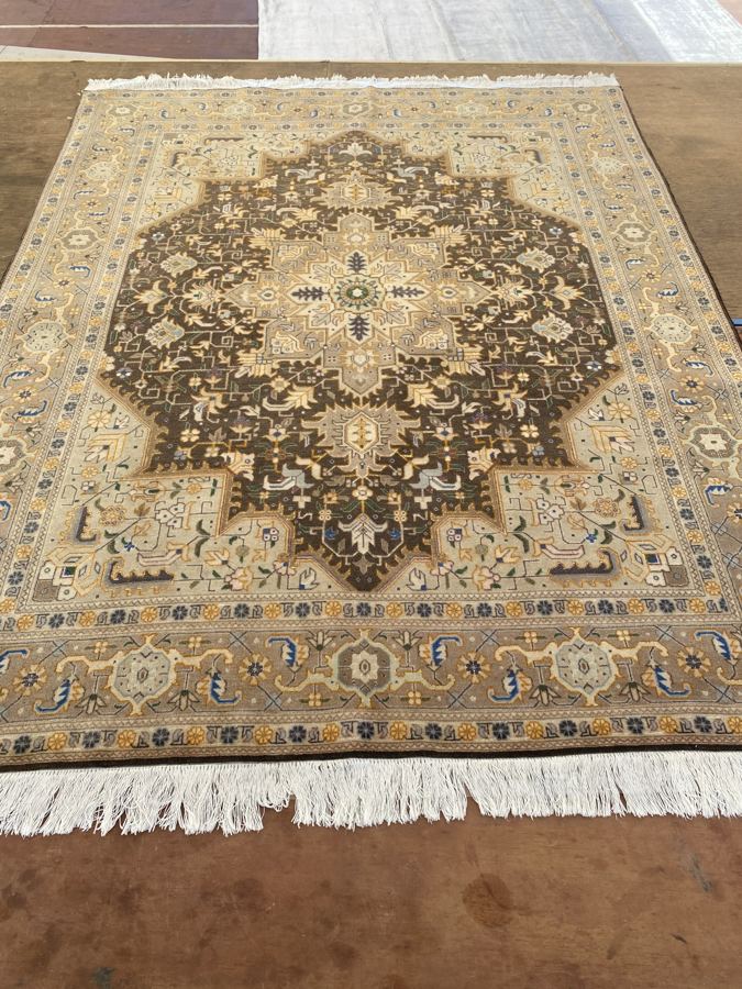 Heriz-design rug with faded brown pile before shearing