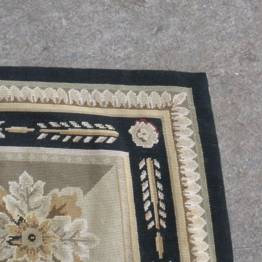 The same needlepoint rug corner after repair